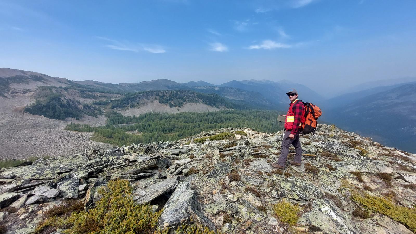 Geologist on a ridge top of the Findlay Property in southeast BC