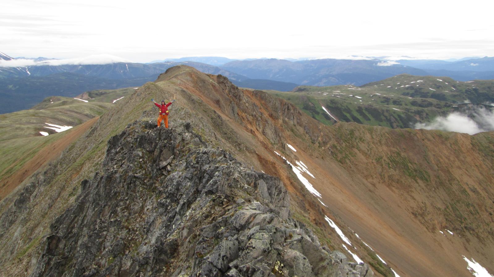 Geologist on ridgeline in Northwest BC