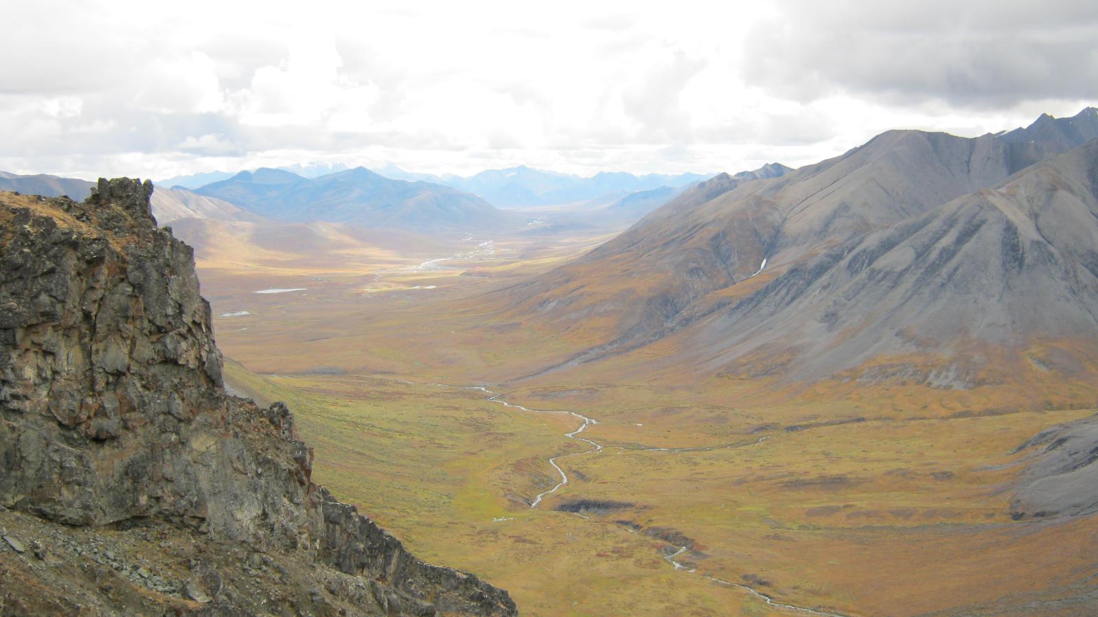 Foreground cliff and beautiful valley vista in the Yukon Territory