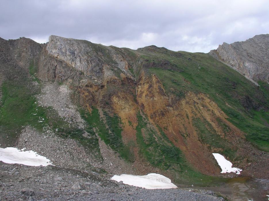 Gossanous Volcanic Pile Underlying a Limestone Host Rock at the MM Critical Minerals Project in the Yukon Territory