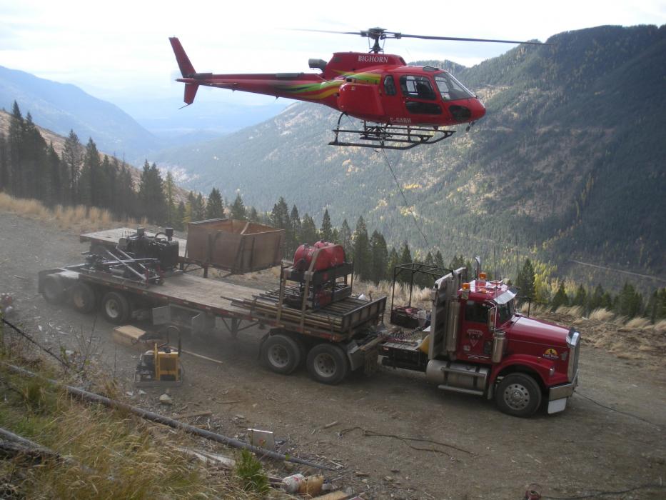 Helicopter mobilizing a drill rig from a semi-truck at the Wildhorse Project in Southeastern British Columbia