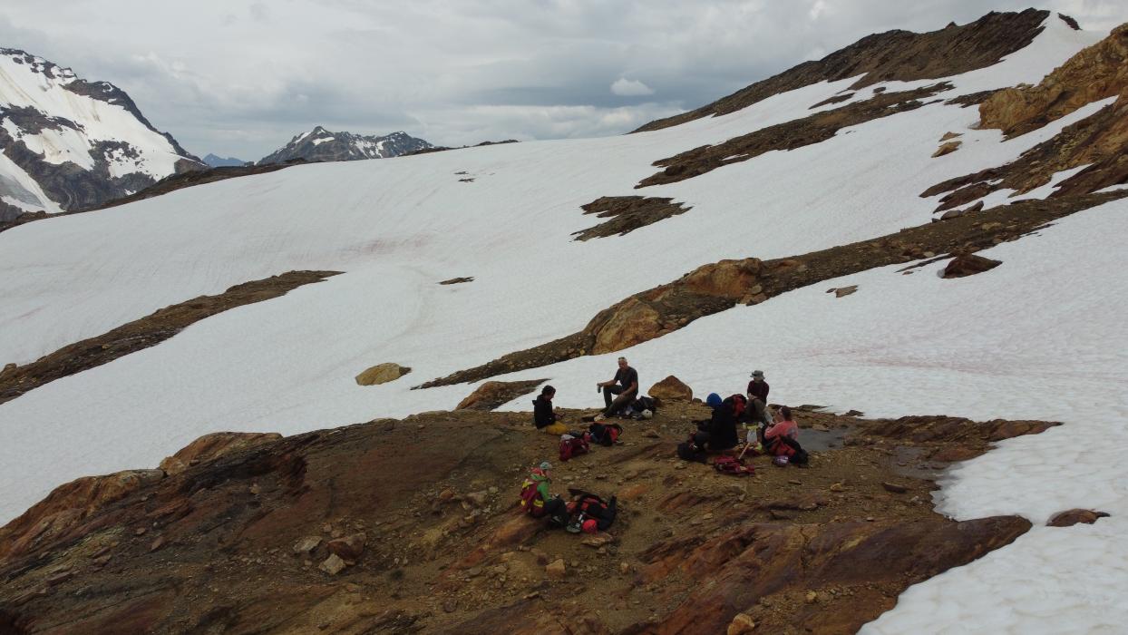 Exploration Geologists Awaiting Pickup in the Alpine at the Adamant Project 2022 Exploration Program