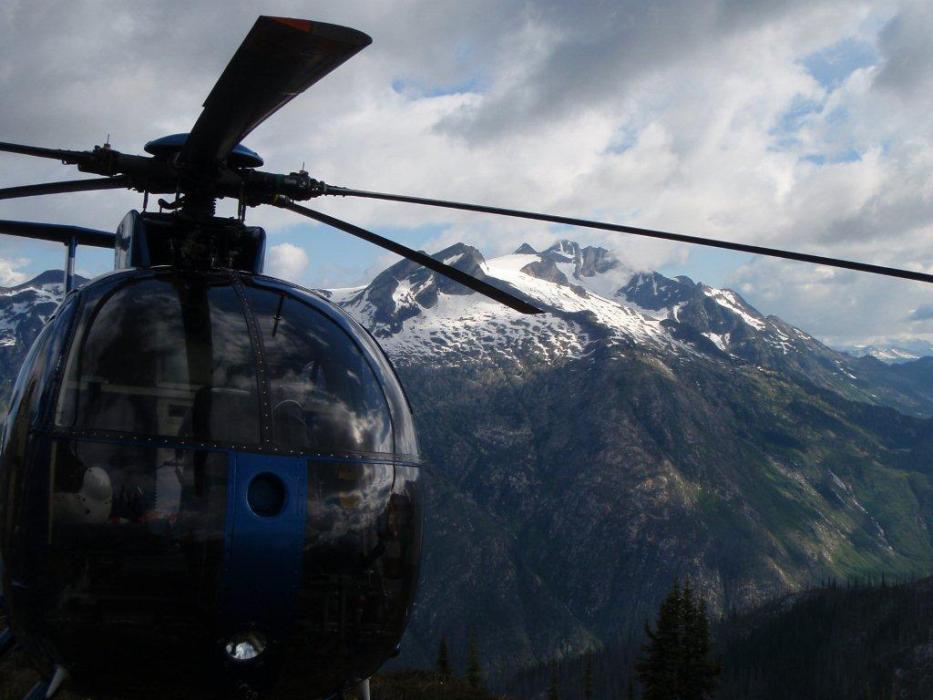 Hughs 500 helicopter standing by in mountain landscape of southeast BC